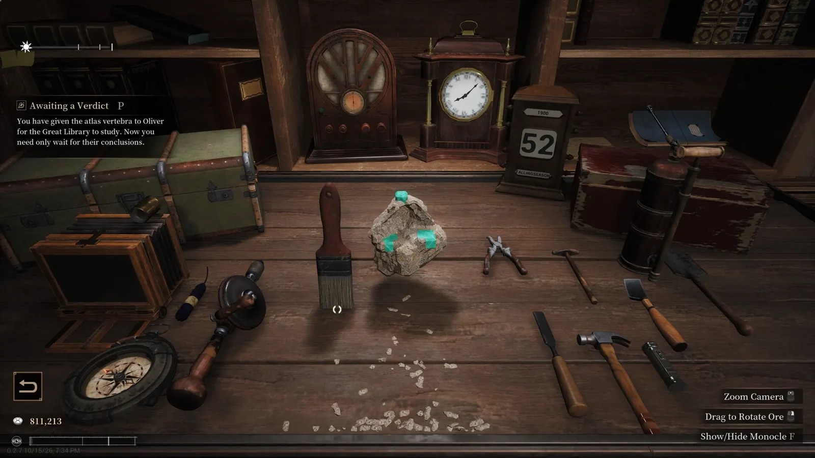 Vermilion House lapidary workbench with chisels, hammers, vintage clock, and raw gemstone rough